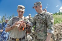 American and Romanian reserve service members participate in an orienteering training event
