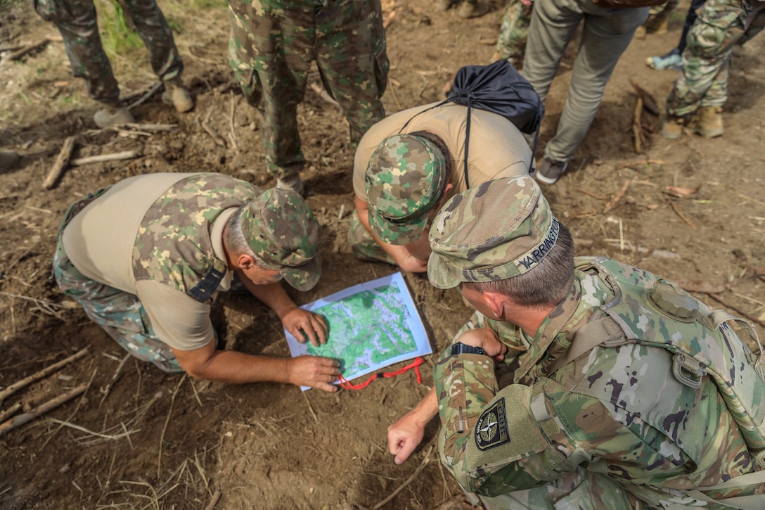 American and Romanian reserve service members participate in an orienteering training event