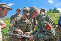 American and Romanian reserve service members participate in an orienteering training event
