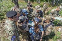 American and Romanian reserve service members participate in an orienteering training event