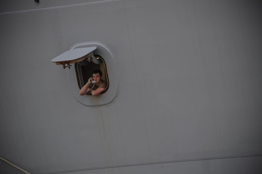 NAVAL STATION NORFOLK (Aug. 17, 2021) A Sailor stands watch aboard the amphibious transport dock ship USS Arlington (LPD 24) as the ship prepares to depart Naval Station Norfolk.  Arlington will support humanitarian assistance and disaster relief (HADR) efforts in Haiti following a 7.2-magnitude earthquake on Aug. 14, 2021. (U.S. Navy photo by Mass Communication Specialist 1st Class Jacob Milham)