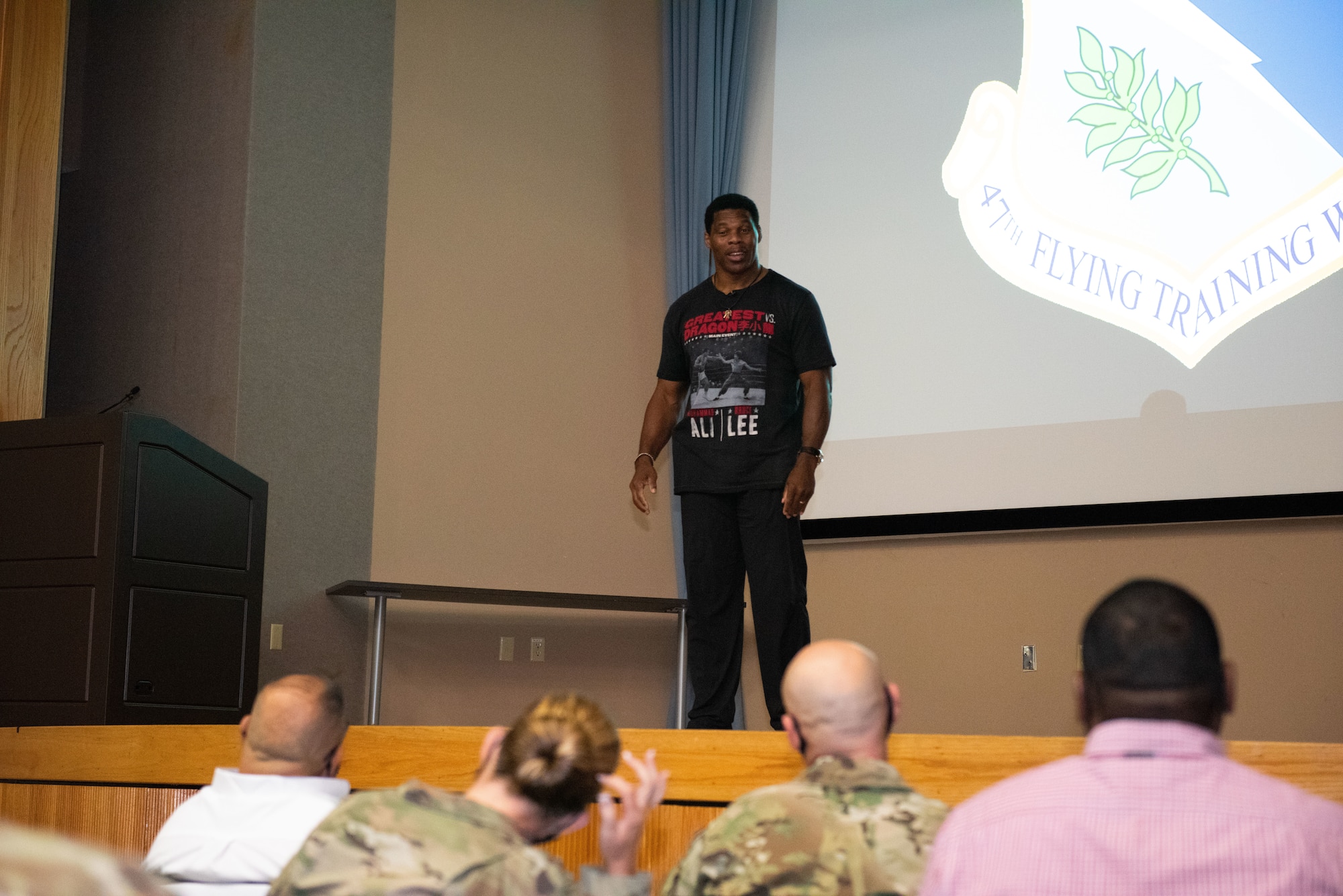 Herschel Walker talks to members of the 47th Flying Training Wing about mental health on Aug. 18th, 2021 at Laughlin Air Force Base, Texas. Walker spoke about the importance of reaching out to others for help and taking advantage of the multiple resources provided on base, such as the Mental Health Clinic and family life counselors at the Airman Family Readiness Center. (U.S. Air Force photo by Airman Kailee Reynolds)