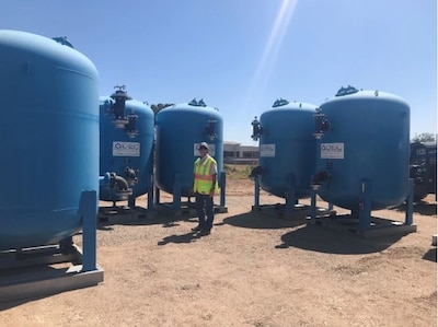 Photo By Armando Perez | A technician checks out the tanks of one of Arizona’s first ion-exchange water filtration systems near Luke Air Force Base, Arizona. Installation of the system has resulted in PFOS/PFOA levels below the Environmental Protection Agency’s lifetime health advisories in drinking water supplied to more than 1,600 addresses outside of Luke AFB. (Courtesy photo)