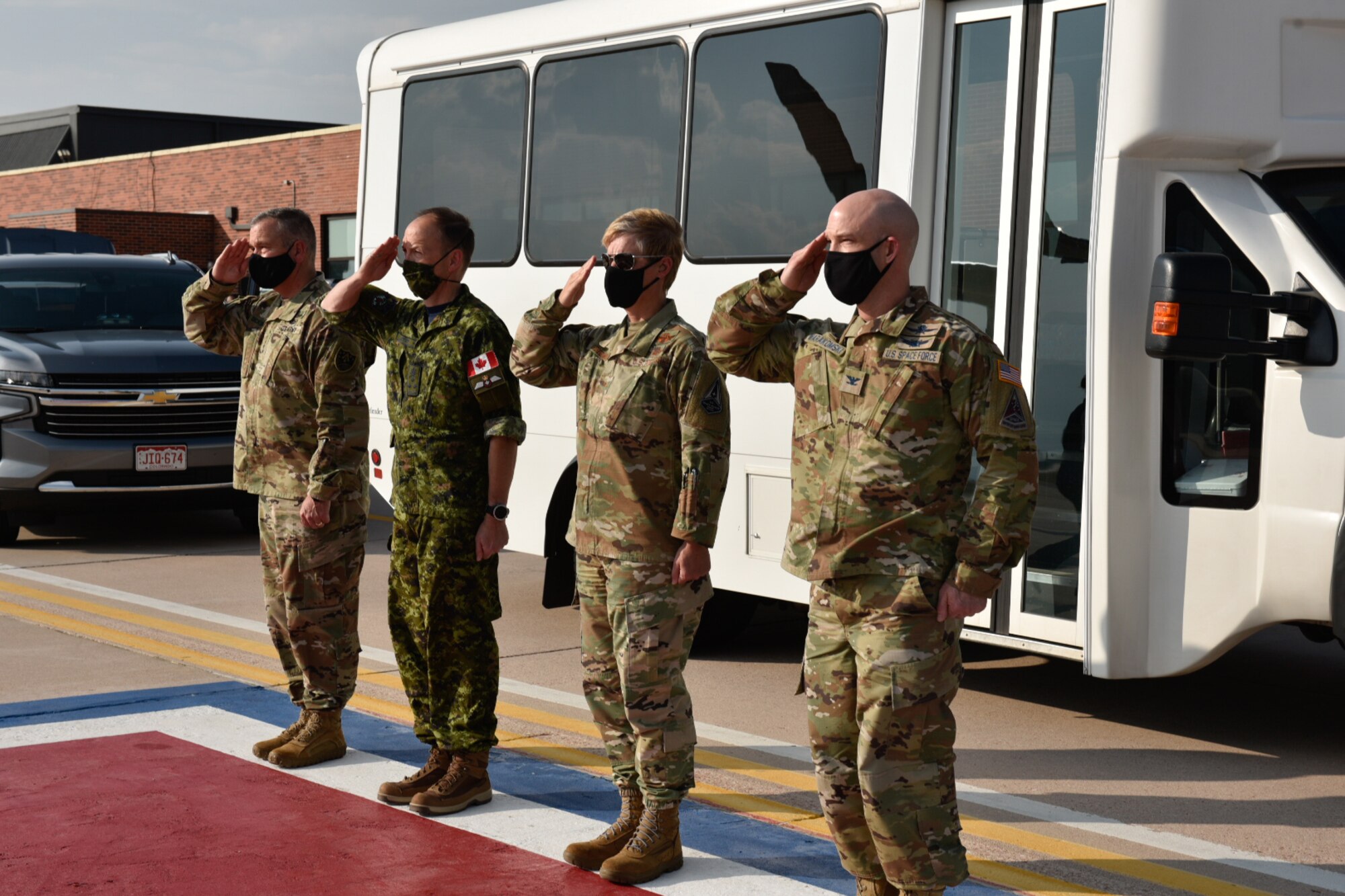 SECAF Frank Kendall is greeted by peterson leadership as he exits his plane