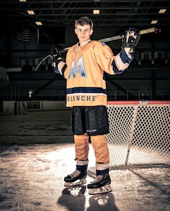 Pfc. Hunter Skaw, a new Soldier in the Alaska Army National Guard, poses for a photo in his Alaska Avalanche Hockey gear. Skaw enlisted while he was a junior at Colony High School in Wasilla, Alaska, and went to basic combat training during the summer before his senior year. He used the Alaska Army National Guard's program to receive high school credits for attending BCT before graduating, and will complete advanced individual training after school. (Courtesy photo by Jeff Heard)