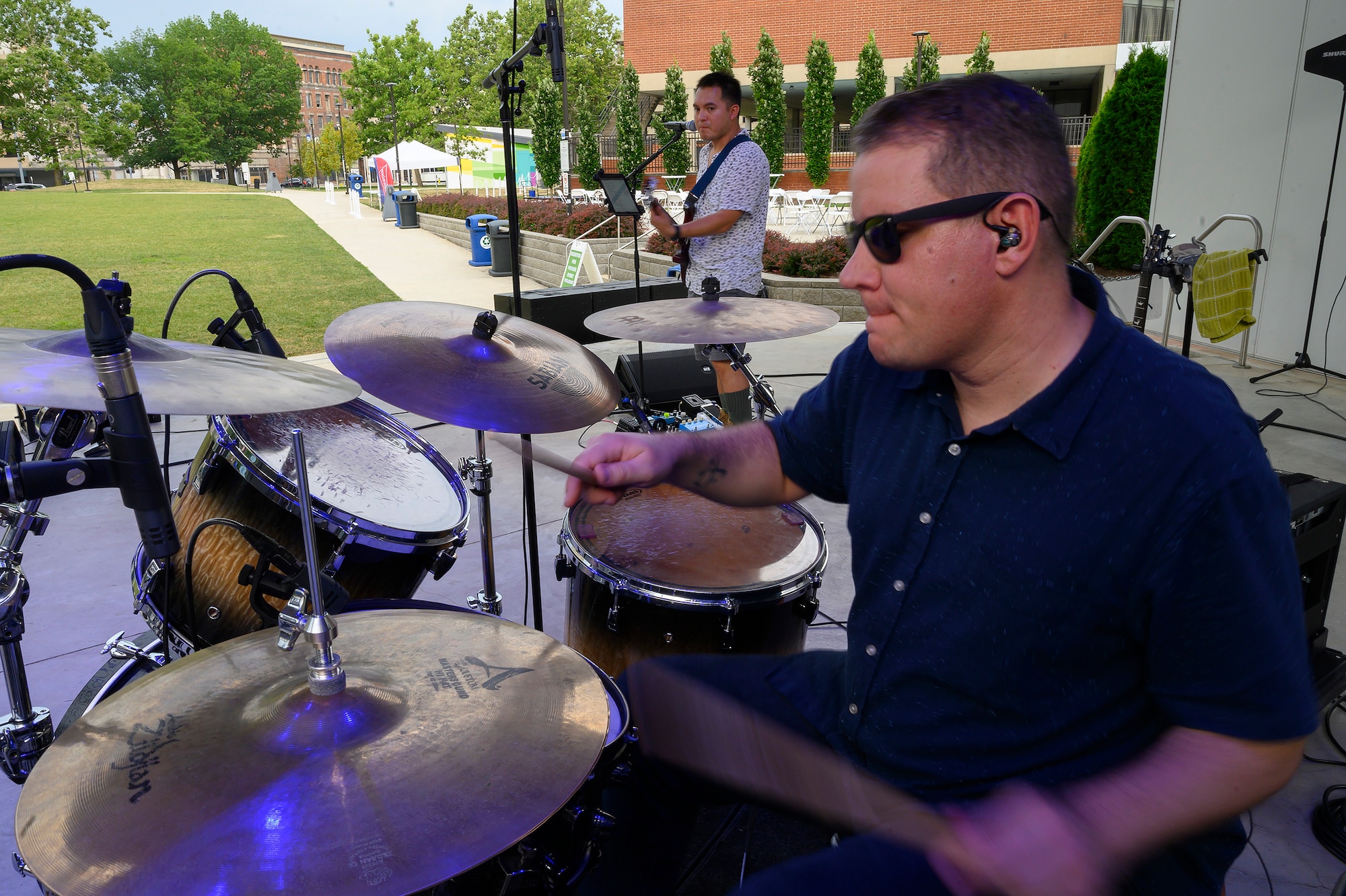 ech. Sgt. Andy Wendzikowski, drummer, and Airman 1st Class Christopher Arellano perform a sound check at Levitt Pavilion in Dayton, Ohio, on Aug. 7, 2021, prior to a scheduled performance of the Air Force Band of Flight’s rock ensemble Flight One. (U.S. Air Force photo by R.J. Oriez)