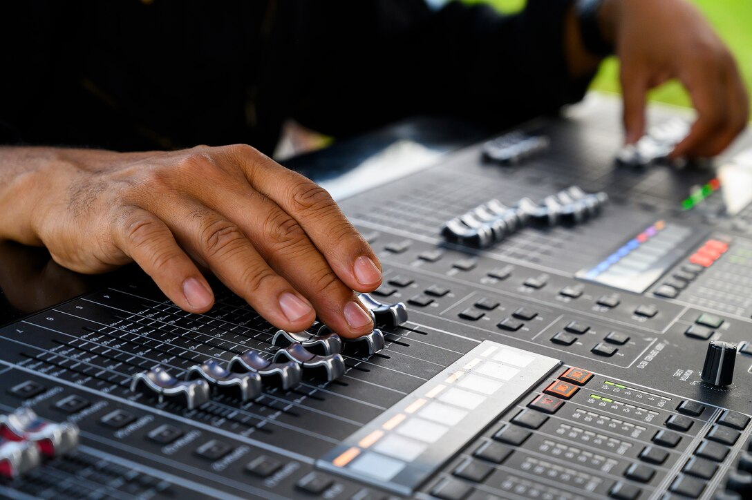 Tech. Sgt. Kelcey McDonald works the sound levels during a performance by Flight One, the Air Force Band of Flight’s rock ensemble, on Aug. 13, 2021, at Centerville Community Amphitheater in Stubbs Park, Centerville, Ohio. (U.S. Air Force photo by R.J. Oriez)