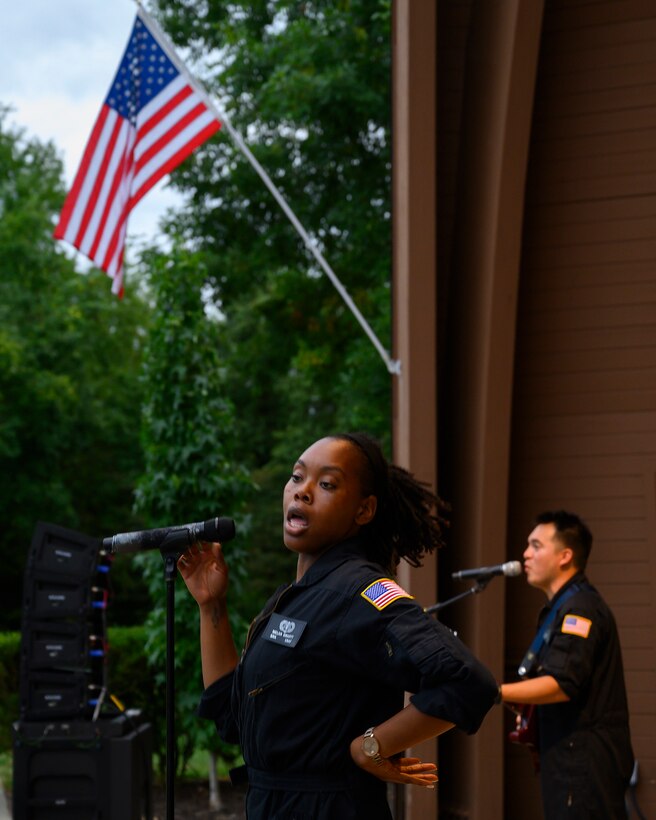 Senior Airman MeLan Smartt and Airman 1st Class Christopher Arellano, along with the rest of the band, perform “Proud Mary,” a song made famous by Tina Turner, during a concert by Flight One at Centerville Community Amphitheater in Stubbs Park, Centerville, Ohio, on Aug. 13, 2021. (U.S. Air Force photo by R.J. Oriez)