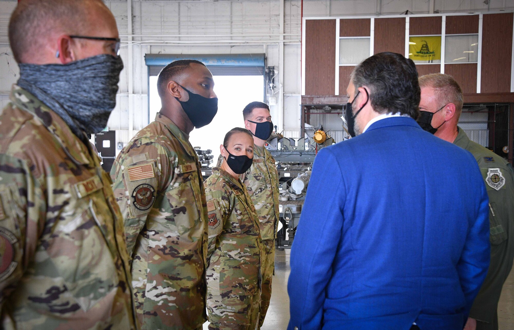 (right) Col. Allen Duckworth 301st Fighter Wing commander introduces Texas Senator Ted Cruz to four deserving Airmen during the senator's visit to Naval Air Station Joint Reserve Base Fort Worth, Texas on August 19, 2021. These outstanding Airmen represented the various units who help the 301 FW accomplish its daily mission.(U.S. Air Force photo by Jeremy Roman)