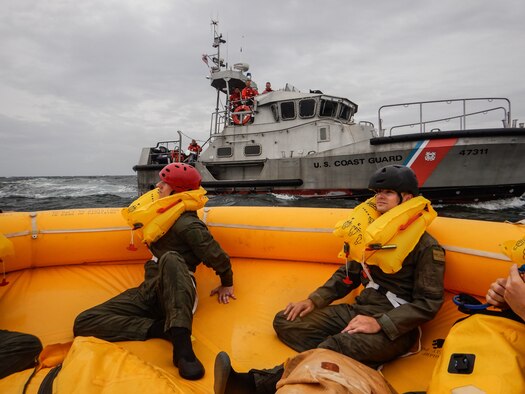 Airmen from the 436th Operational Support Squadron survival, evasion, resistance and escape flight sit in a 25-man survival raft near Coast Guard Station Indian River Inlet, Delaware, Aug. 4, 2021. Exercise Castaway is an interagency training exercise that brought Airmen from Dover AFB and two coast guard stations, Coast Guard Air Station Atlantic City, New Jersey, and Coast Guard Station Indian River Inlet, Delaware, together to train local search and rescue procedures. (U.S. Air Force photo by Senior Airman Marco A. Gomez)