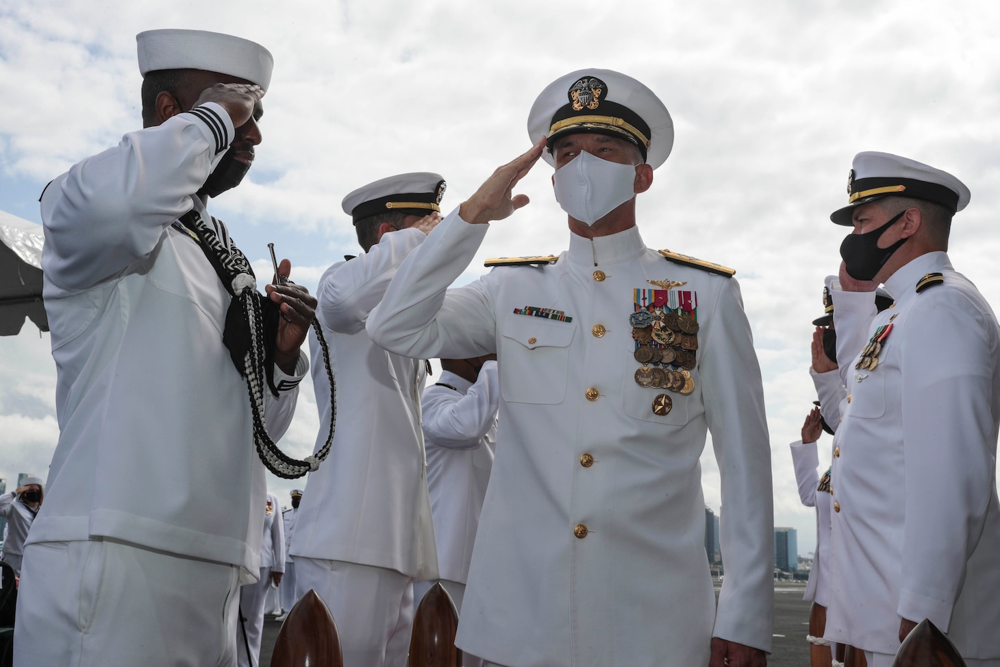 Rear Adm. Jeffrey T. Anderson, commander, Carrier Strike Group 3, is pipped aboard the aircraft carrier USS Abraham Lincoln (CVN 72) during a change of command ceremony held on the flight deck.