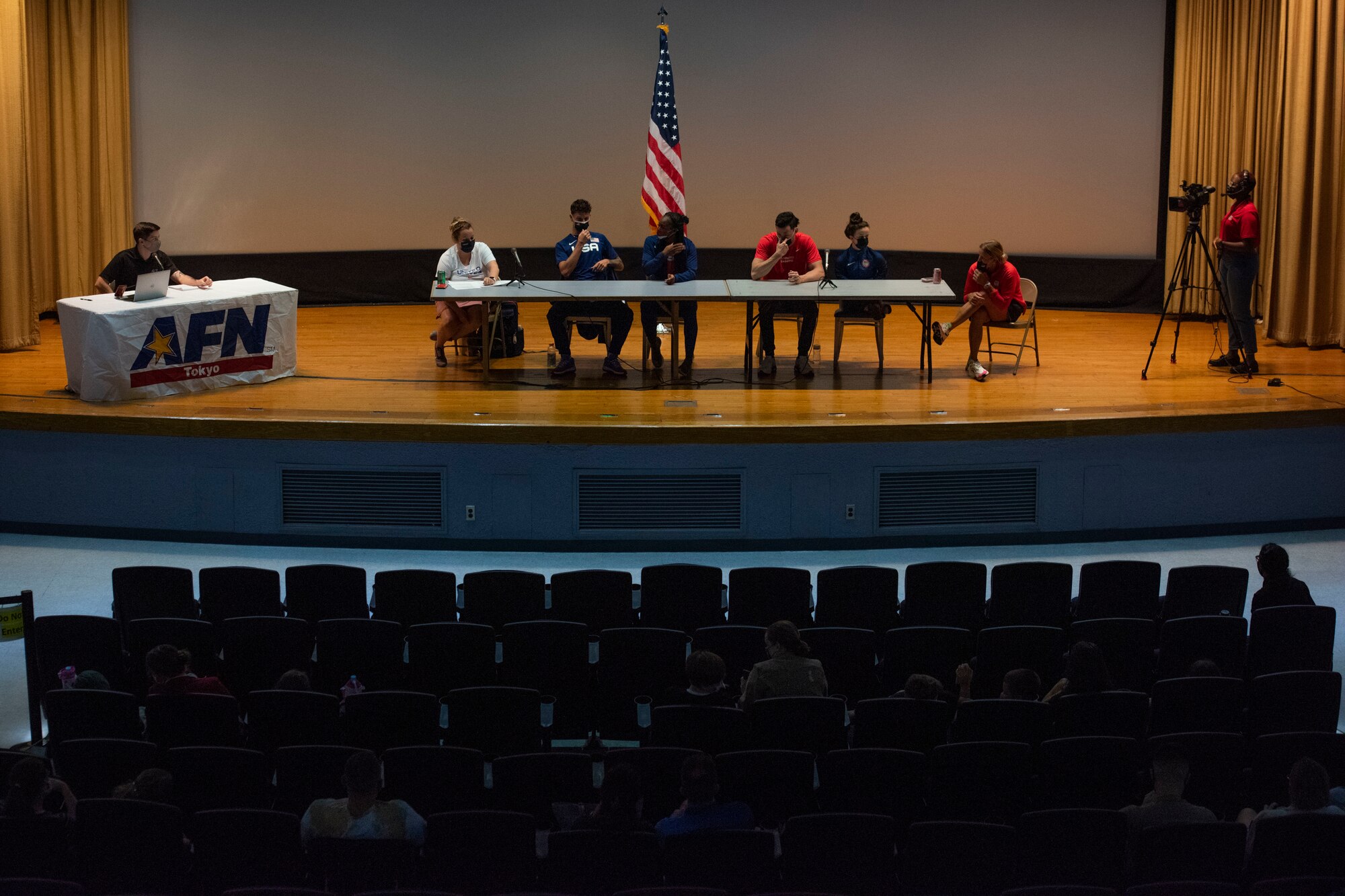 Team USA Paralympians from the Para swim team as well as the Para track and field team answer questions from audience members at Yokota Air Base, Japan, Aug. 18, 2021. The competitors answered questions about their personal lives, backgrounds and being a Paralympian. (U.S. Air Force photo by Staff Sgt. Joshua Edwards)