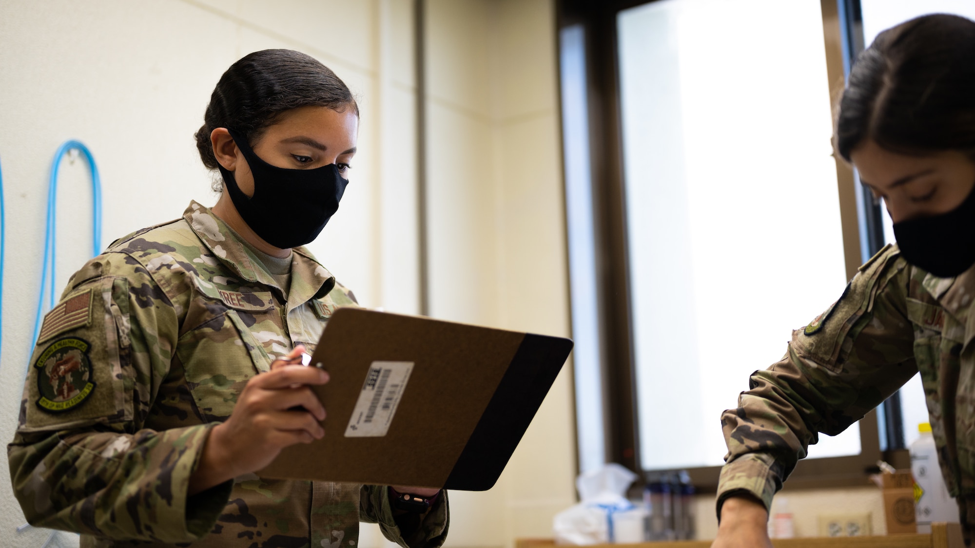 U.S. Air Force Senior Airman Lamarah Tyree, left, 18th Operational Medical Readiness Squadron bioenvironmental engineer journeyman, and Airman 1st Class Jeneane Jaber, right, 18th OMRS bioenvironmental engineer apprentice, inventory equipment for mask fit tests at Kadena Air Base, Japan, Aug. 20, 2021. Bioenvironmental engineers oversee the safety and management of environmental factors for over 8,000 housing units and industrial facilities island-wide. (U.S. Air Force photo by Airman 1st Class Stephen Pulte