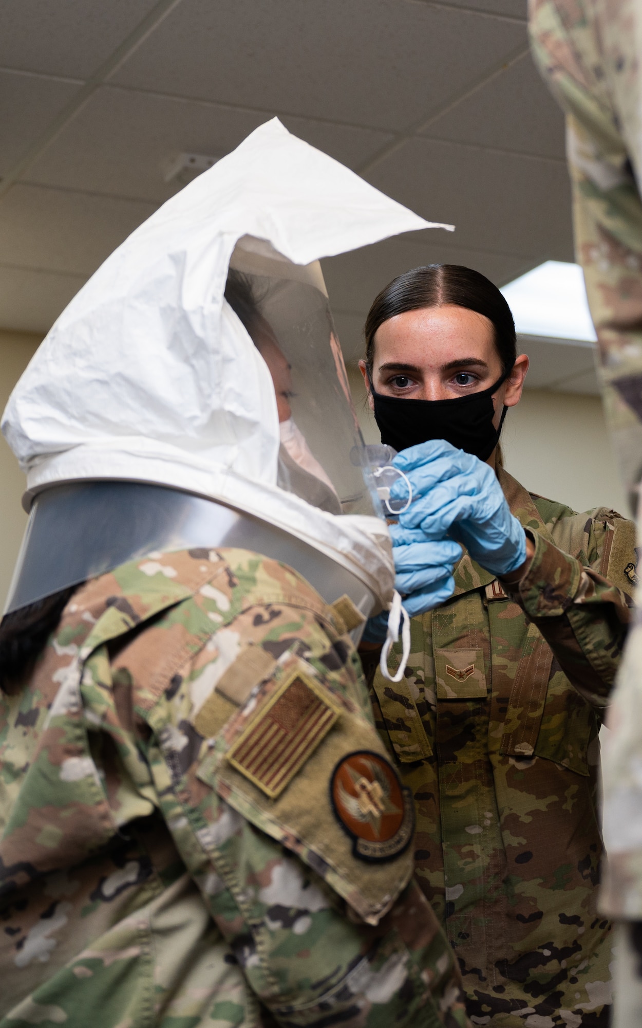 U.S. Air Force Airman 1st Class Greta Meivel, 18th Operational Medical Readiness Squadron bioenvironmental engineer apprentice, administers bitrex during a mask fit test at Kadena Air Base, Japan, Aug. 20, 2021. The first step in a mask fit test is to expose the individual to the compound so they know what to expect. (U.S. Air Force photo by Airman 1st Class Stephen Pulter)