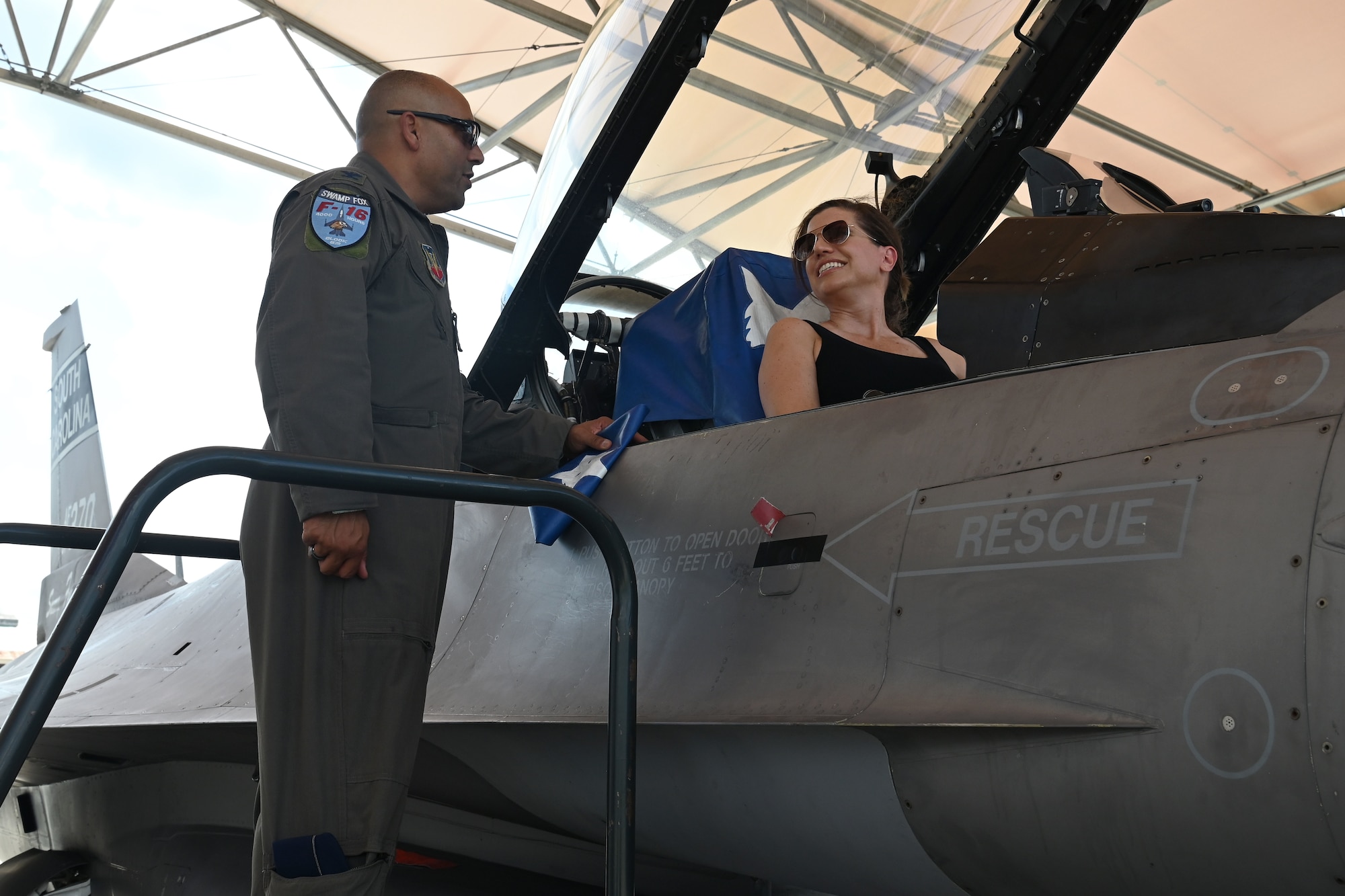 U.S. Rep. Nancy Mace from Charleston, South Carolina speaks with South Carolina National Guard senior leadership during her visit to McEntire Joint National Guard Base, South Carolina Aug.19, 2021. U.S. Air Force Col. Akshai Gandhi, 169th Fighter Wing commander provides Mace a close-up inspection of an F-16 Fighting Falcon jet. The purpose of her visit is to meet with South Carolina National Guard leadership to discuss the current state of the South Carolina National Guard and future endeavors for the organization as well as a familiarization of the base and the capabilities of the units housed there. (U.S. Air National Guard photo by Senior Master Sgt. Edward Snyder, 169th Fighter Wing Public Affairs)