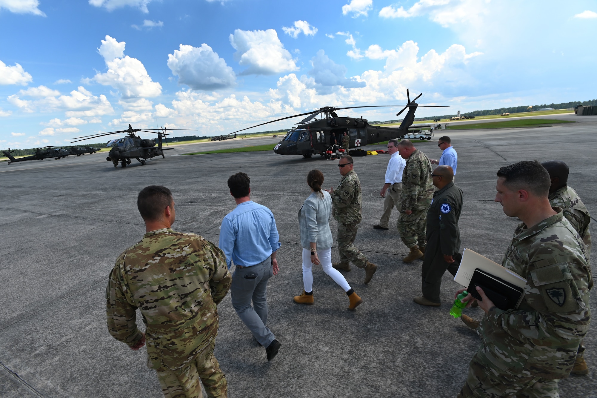 U.S. Rep. Nancy Mace and her staff from Charleston, South Carolina join leaders of the South Carolina National Guard on a tour of the helicopter flight line at McEntire Joint National Guard Base, South Carolina during her visit Aug. 19, 2021. The purpose of her visit is to meet with South Carolina National Guard leadership to discuss the current state of the South Carolina National Guard and future endeavors for the organization as well as a familiarization of the base and the capabilities of the units housed there. (U.S. Air National Guard photo by Senior Master Sgt. Edward Snyder, 169th Fighter Wing Public Affairs)