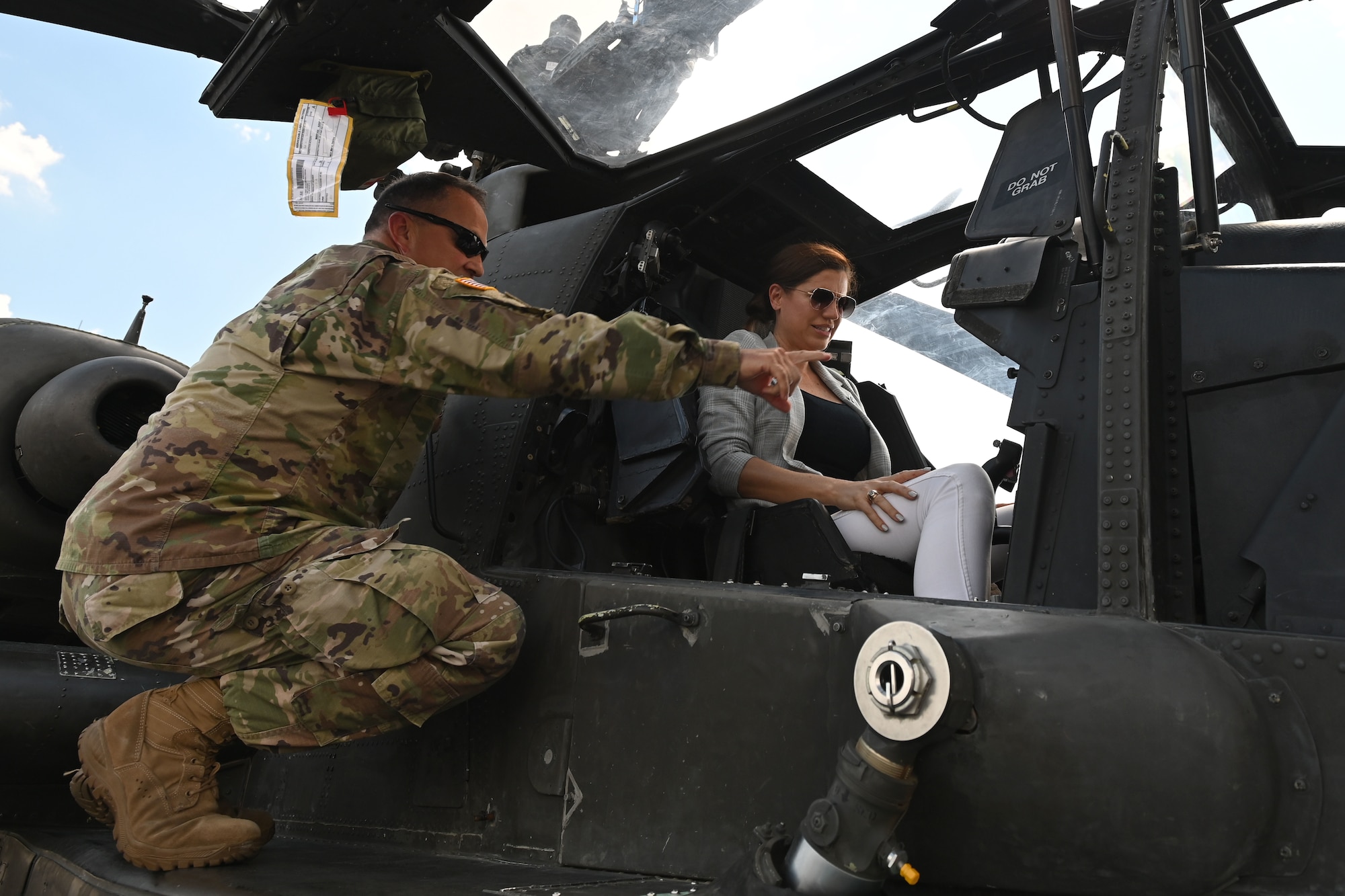 U.S. Rep. Nancy Mace from Charleston, South Carolina speaks with South Carolina National Guard senior leadership during her visit to McEntire Joint National Guard Base, South Carolina Aug.19, 2021. U.S. Army Col. John McElveen, 59th Troop Command commander provides Mace a close-up inspection of an AH-64 Apache helicopter. The purpose of her visit is to meet with South Carolina National Guard leadership to discuss the current state of the South Carolina National Guard and future endeavors for the organization as well as a familiarization of the base and the capabilities of the units housed there. (U.S. Air National Guard photo by Senior Master Sgt. Edward Snyder, 169th Fighter Wing Public Affairs)