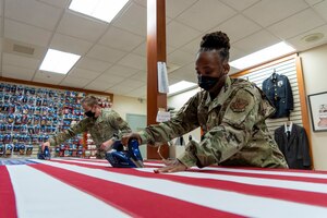 U.S. Flag preparation at Air Force Mortuary Affairs Operations