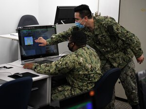 Surface Warfare Engineering School Command Great Lakes Instructor Gas Turbine Systems Technician (Mechanical) 1st Class Uriel I. Berrun goes over the four normal conditions that happen during the startup of the Gas Turbine Generator.