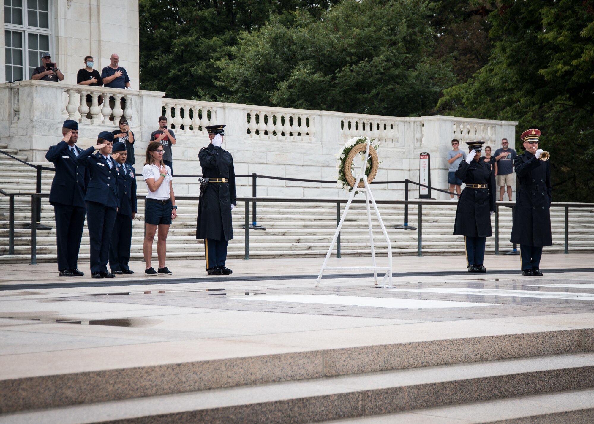 From left: Senior Master Sgt. Mark Schneider II, of the 179th Airlift Wing, Ohio National Guard; Senior Airman Ruth-Ann Bell, of the 193rd Special Operations Wing, Pennsylvania National Guard; Master Sgt. John Stegen, of the 153rd Airlift Wing, Wyoming National Guard; and Ms. Jennifer Weir, wife of Master Sgt. Tyler Weir, 120th Airlift Wing, Montana National Guard, participate in a wreath laying ceremony at the Tomb of the Unknown Soldier at Arlington National Cemetery, Arlington, Virginia, Aug. 16, 2021. The event was part of Focus on the Force Week 2021—an annual event hosted by the command chief of the Air National Guard that highlights professional development and celebrates the accomplishments of the enlisted corps. (U.S. Air National Guard photo by Tech. Sgt. Morgan R. Whitehouse)