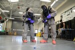 Weapons of Mass Destruction Civil Support Team members discuss response actions to a potential chemical, biological, or radiological threat while participating in a training event at Ft. Buchanan, Puerto Rico, Aug. 17, 2021. The training scenarios include response, evaluation, testing, and securing the area of contamination. The members are made up of soldiers and airmen from the 33rd WMD-CST, District of Columbia National Guard, along with other CST's from Texas, North Carolina, West Virginia, Puerto Rico and the District of Columbia Fire and Emergency Management Service.