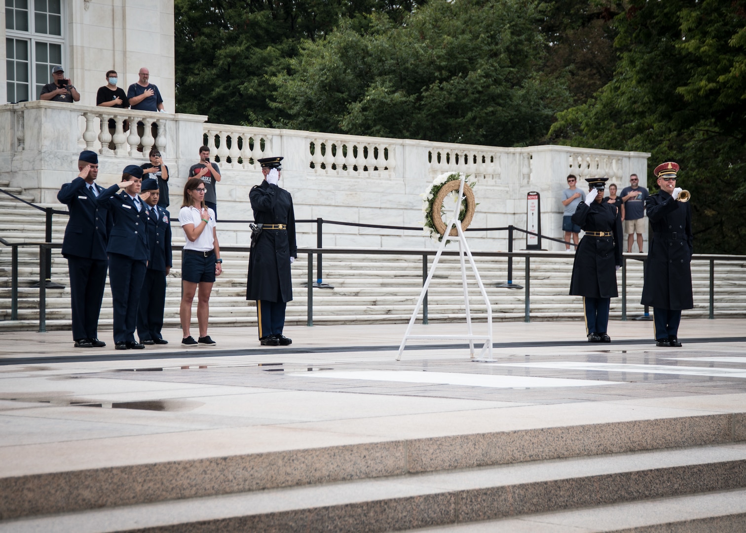 From left: Senior Master Sgt. Mark Schneider II, of the 179th Airlift Wing, Ohio National Guard; Senior Airman Ruth-Ann Bell, of the 193rd Special Operations Wing, Pennsylvania National Guard; Master Sgt. John Stegen of the 153rd Airlift Wing, Wyoming National Guard; and Ms. Jennifer Weir, wife of Master Sgt. Tyler Weir, 120th Airlift Wing, Montana National Guard, participates in a wreath laying ceremony at the Tomb of the Unknown Soldier at Arlington National Cemetery, Arlington, Virginia, August 16, 2021.