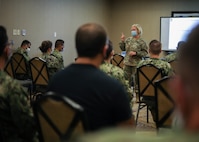 U.S. Army Brig. Gen. Cindy Haygood, the dual-status commander for the state of Louisiana, gives opening remarks during a joint reception, staging, onward movement and integration brief to a medical support team from Navy Medicine Readiness and Training Command Bethesda as part of COVID-19 response operations in Lafayette, Louisiana, Aug. 18, 2021.