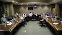 Medical providers from Navy Medicine Readiness and Training Command Bethesda and   physicians and surgeons with Ochsner Lafayette General Medical Center discuss the hospital’s COVID-19 patient care protocols during the COVID response operations in Lafayette, Louisiana, Aug. 19, 2021.