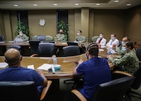 Medical providers from Navy Medicine Readiness and Training Command Bethesda and   physicians and surgeons with Ochsner Lafayette General Medical Center discuss the hospital’s COVID-19 patient care protocols during COVID response operations in Lafayette, Louisiana, Aug. 19, 2021.