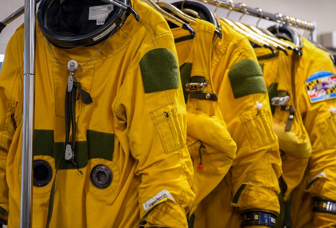 9th Physiological Support Squadron full-pressure suits hang on racks Aug. 4, 2021, at Beale Air Force Base, California.