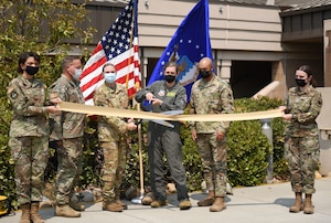 Col. Heather Fox, 9th Reconnaissance Wing commander and Lt. Col. Alisha Earls, 9th Physiological Support Squadron (PSPTS) commander, stands with other 9 PSPTS Airmen as they cut the ceremonial ribbon Aug. 20, 2021, at Beale Air Force Base, California.