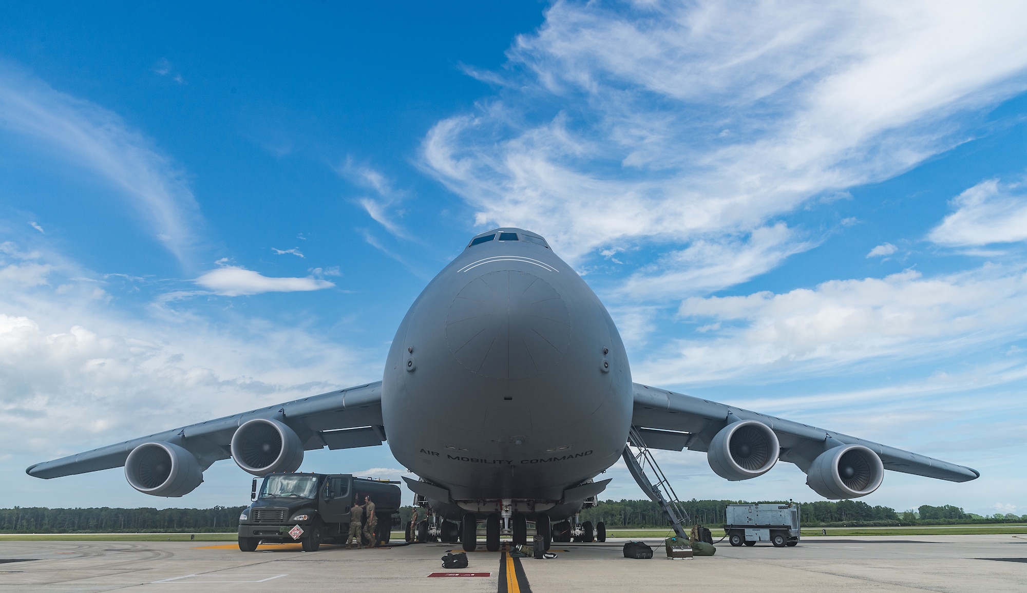 Personnel from the 436th Aircraft Maintenance and 436th Logistics Readiness Squadrons refuel a C-5M Super Galaxy prior to its departure from Dover Air Force Base, Delaware, Aug. 18, 2021. The C-5M is a strategic transport aircraft and is the largest aircraft in the U.S. Air Force inventory. (U.S. Air Force photo by Roland Balik)