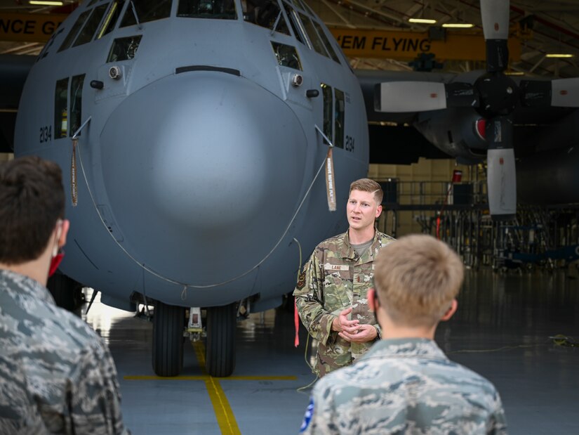 U.S. Air Force 2nd Lt. John Lane, assigned to the 103rd Maintenance Squadron, briefs Civil Air Patrol cadets on the 103rd Airlift Wing’s C-130H Hercules tactical airlift mission during a tour of Bradley Air National Guard Base in East Granby, Connecticut, Aug. 13, 2021. Cadets from the Connecticut Wing’s Danielson and Plainville squadrons got an up-close look at C-130H aircraft, the engines that power them, and learned about the 103rd Airlift Wing’s mission. (U.S. Air National Guard photo by Tech. Sgt. Steven Tucker)