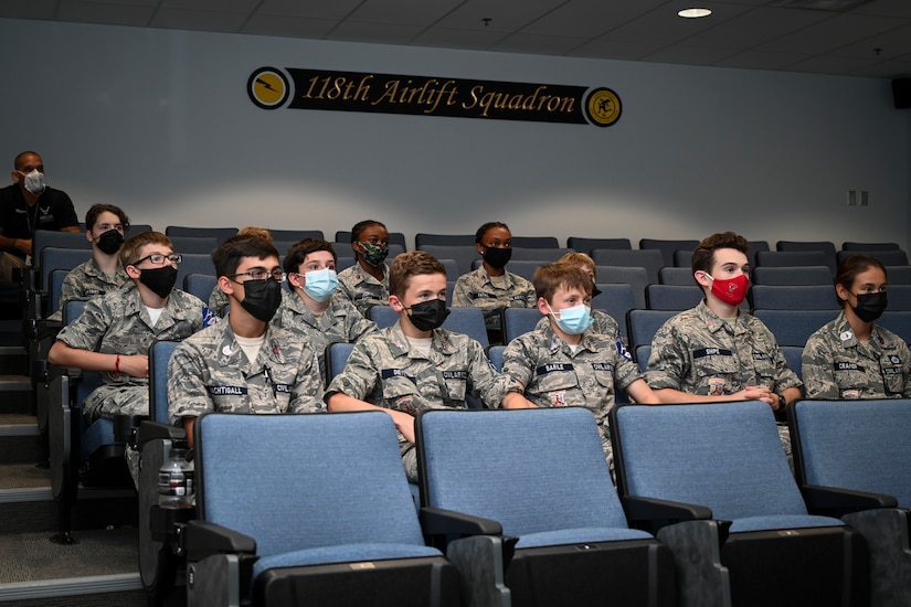 Civil Air Patrol cadets from the Connecticut Wing’s Danielson and Plainville squadrons listen to a 103rd Airlift Wing mission briefing during a tour of Bradley Air National Guard Base in East Granby, Connecticut, Aug. 13, 2021. Cadets got an up-close look at C-130H aircraft, the engines that power them, and learned about the 103rd Airlift Wing’s mission. (U.S. Air National Guard photo by Tech. Sgt. Steven Tucker)