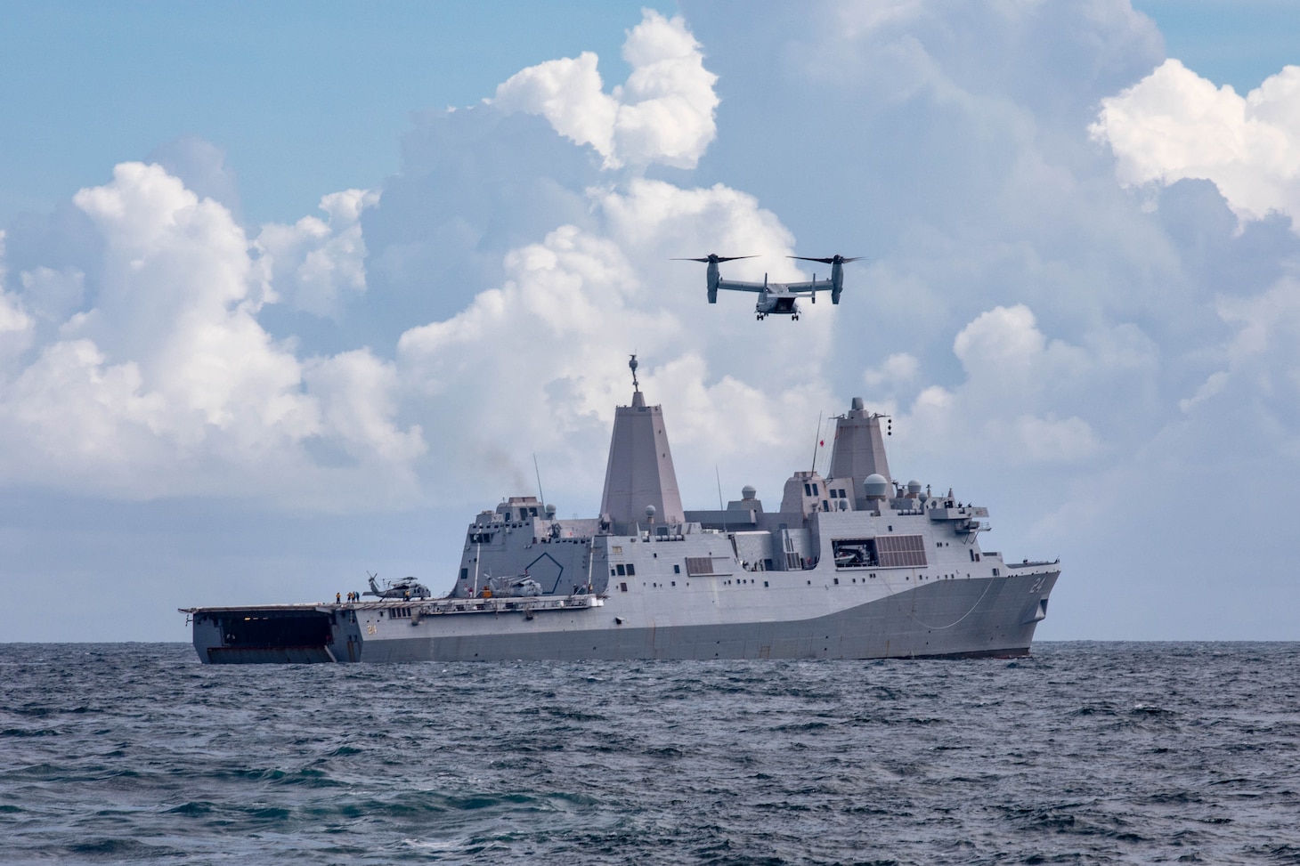 An MV-22 Osprey transport aircraft assigned to the “Fighting Griffins” of Marine Medium Tiltrotor Squadron (VMM) 266 prepares to land on the San Antonio-class amphibious transport dock ship USS Arlington (LPD 24) to deliver supplies in support of the ship’s mission to Haiti, Aug. 18, 2021.