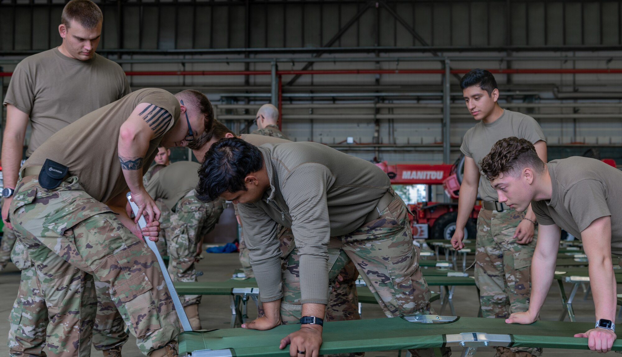 Airmen prepare cots.