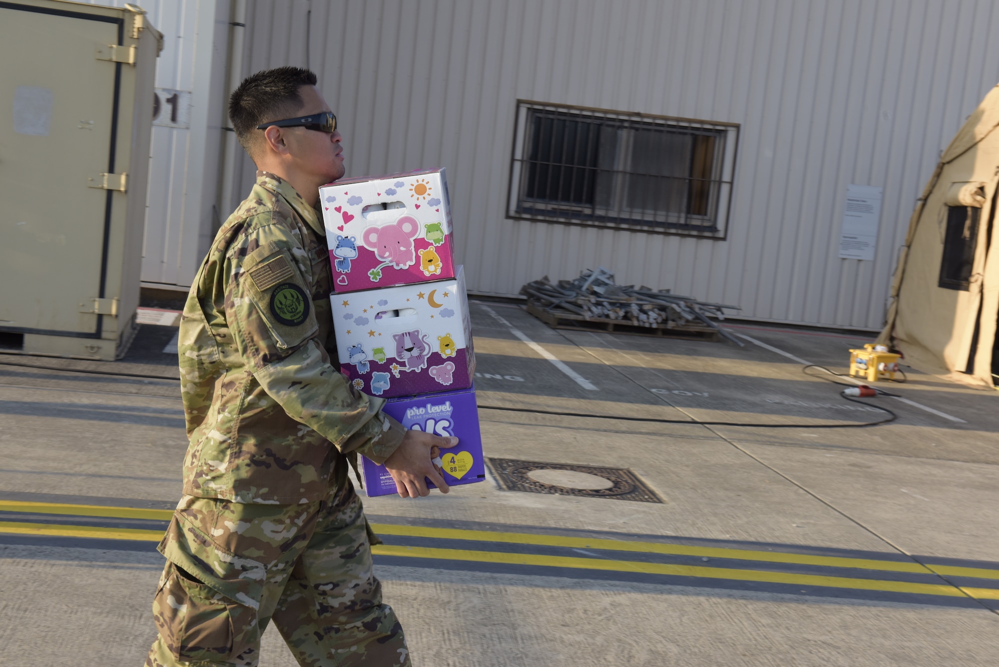 Airman carries diapers.