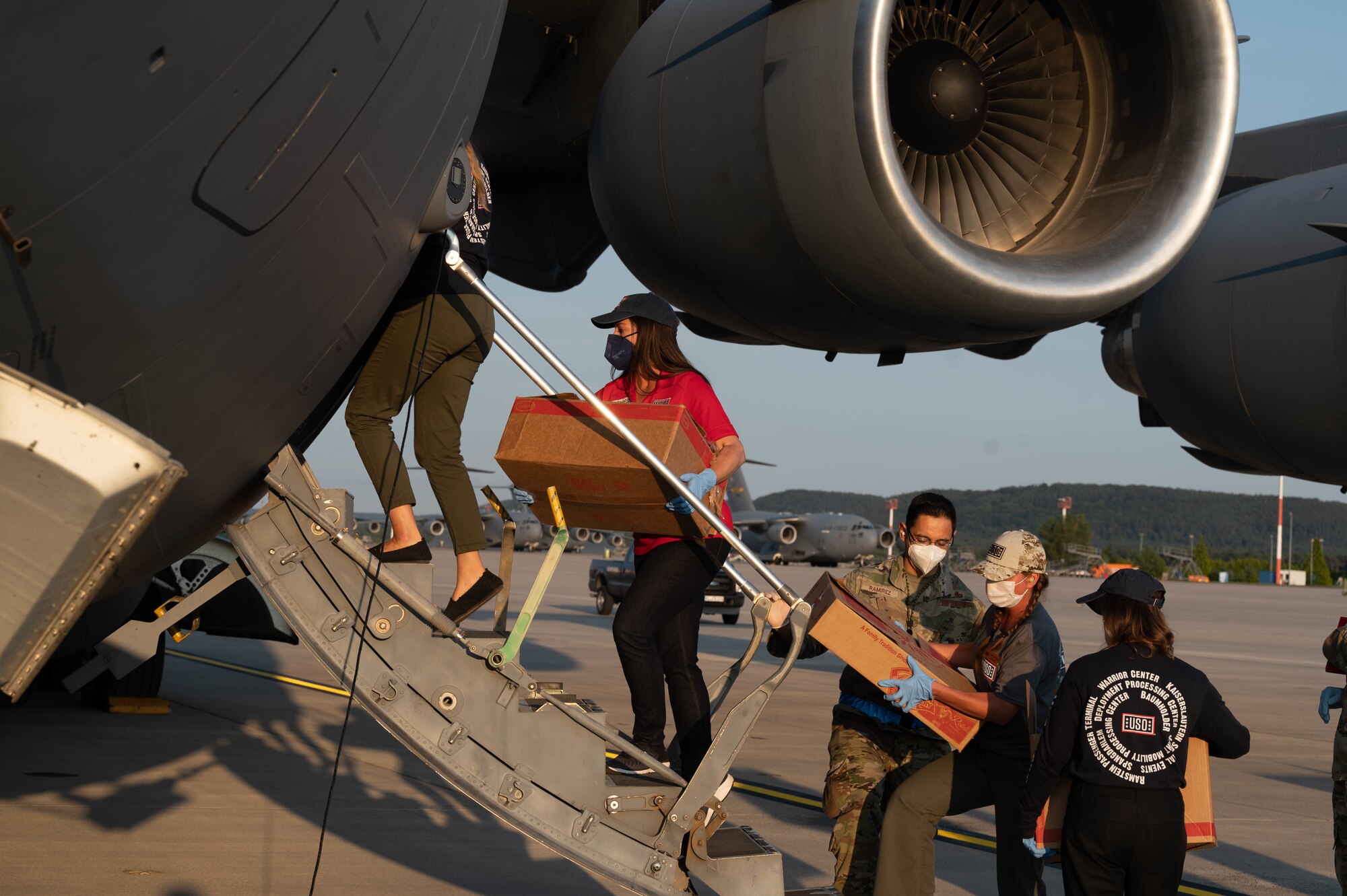 Supplies are carried onto aircraft.