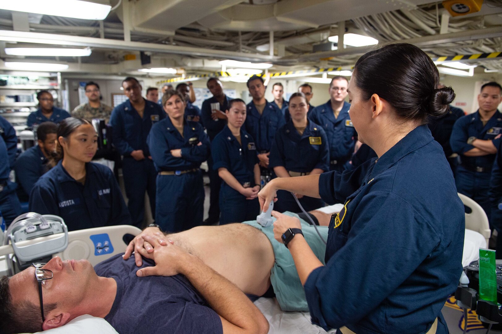 Lt. Cmdr, Stacy Coulthard, a surgeon assigned to Fleet Surgical Team (FST) 2, conducts ultrasound training to practice assessing traumatic injuries aboard the San Antonio-class amphibious transport dock ship USS Arlington (LPD 24), Aug. 20, 2021.