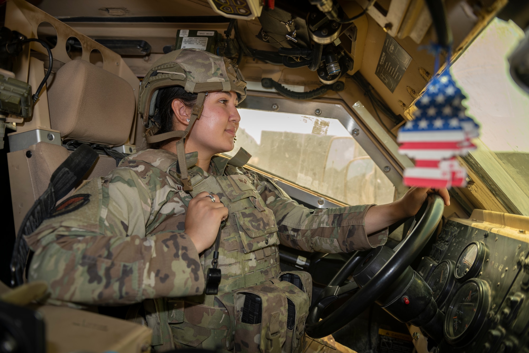 U.S. Air Force Senior Airman Lillianna Sanchez, 332nd Expeditionary Security Forces Squadron response force member, performs a perimeter check July 31, 2021, in an undisclosed location somewhere in Southwest Asia. The 332nd ESFS is tasked with providing force protection, ensuring operational readiness and protecting warfighting resources as well as its personnel. (U.S. Air Force photo by Senior Airman Cameron Otte)