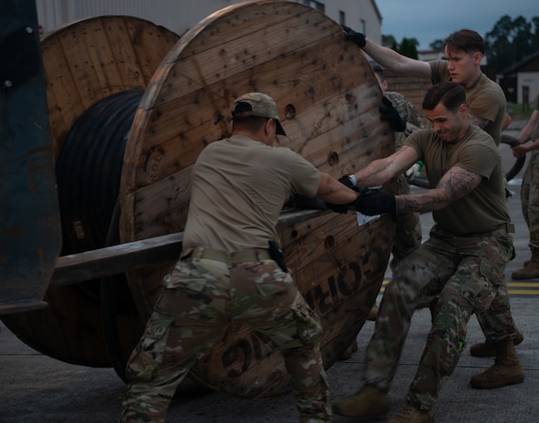 Airmen prepare tents and supplies.