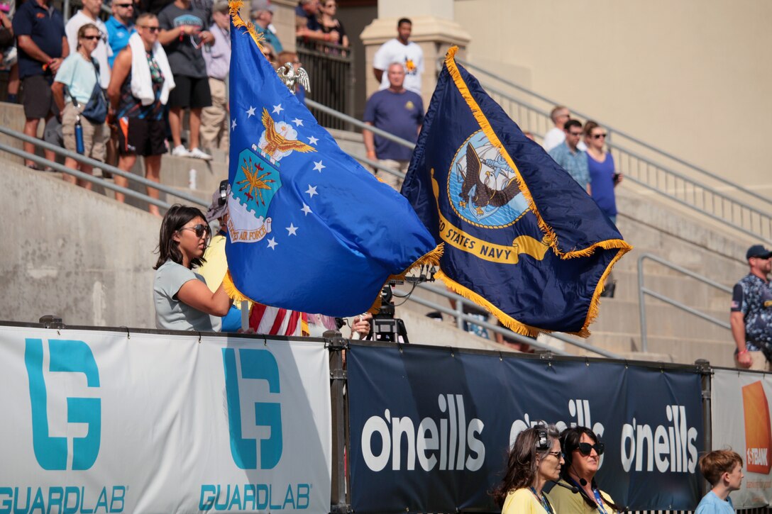 Service songs of the Navy and Air Force play as Navy and Air Force face each other in the 2021 Armed Forces Rugby Championship match held in conjunction with the 2021 Rugbytown 7's Tournament, held from 20-22 August.  Service members from the Navy, Air Force (with Space Force personnel) and Coast Guard battle it out for gold.  (Department of Defense Photo, Released)