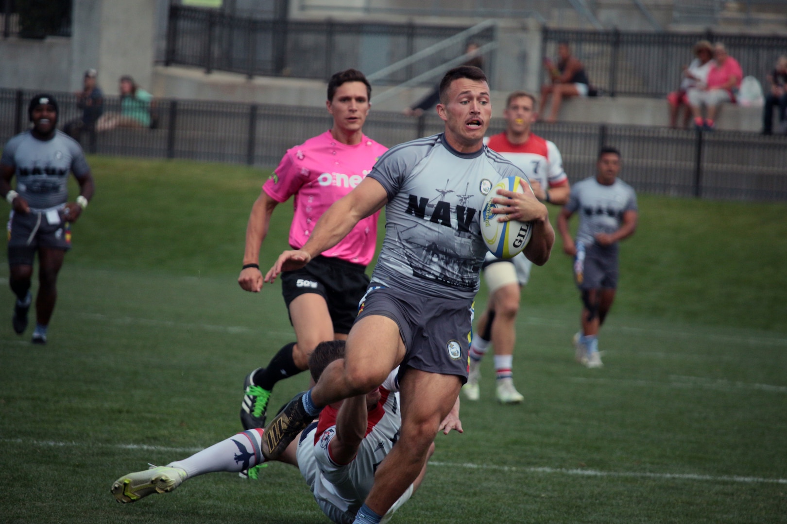 Navy Ensign Collin Argue of Naval Air Station Pensacola, Fla. breaks free for the try in the championship match of the 2021 Armed Forces Rugby Championship held in conjunction with the 2021 Rugbytown 7's Tournament, held from 20-22 August.  Service members from the Navy, Air Force (with Space Force personnel) and Coast Guard battle it out for gold.  (Department of Defense Photo, Released)