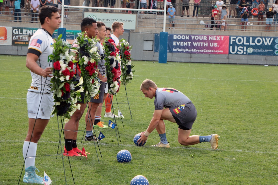 Team members from each Service branch take part in the annual Fallen Rugger Ceremony to commemorate rugby players who made the ultimate sacrifice to their country. The ceremony was held at the conclusion of the championship match of the 2021 Armed Forces Rugby Championship held in conjunction with the 2021 Rugbytown 7's Tournament, held from 20-22 August.  Service members from the Navy, Air Force (with Space Force personnel) and Coast Guard battle it out for gold.  (Department of Defense Photo, Released)