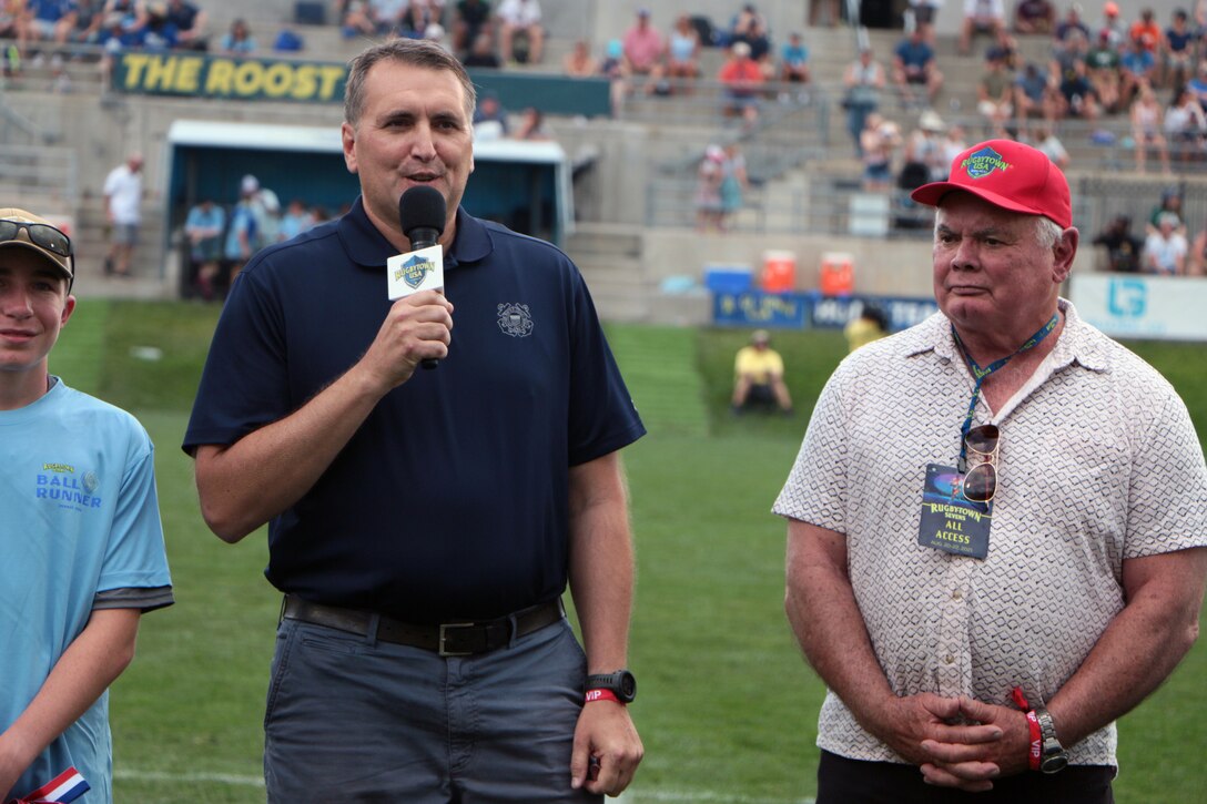 Mr. Matt Perciak (left), Director of Coast Guard Morale, Well-Being, and Recreation and Glendale Mayor Mike Dunafon (right) hand out awards to the gold and silver medal teams during the 2021 Armed Forces Rugby Championship held in conjunction with the 2021 Rugbytown 7's Tournament, held from 20-22 August.  Service members from the Navy, Air Force (with Space Force personnel) and Coast Guard battle it out for gold.  (Department of Defense Photo, Released)