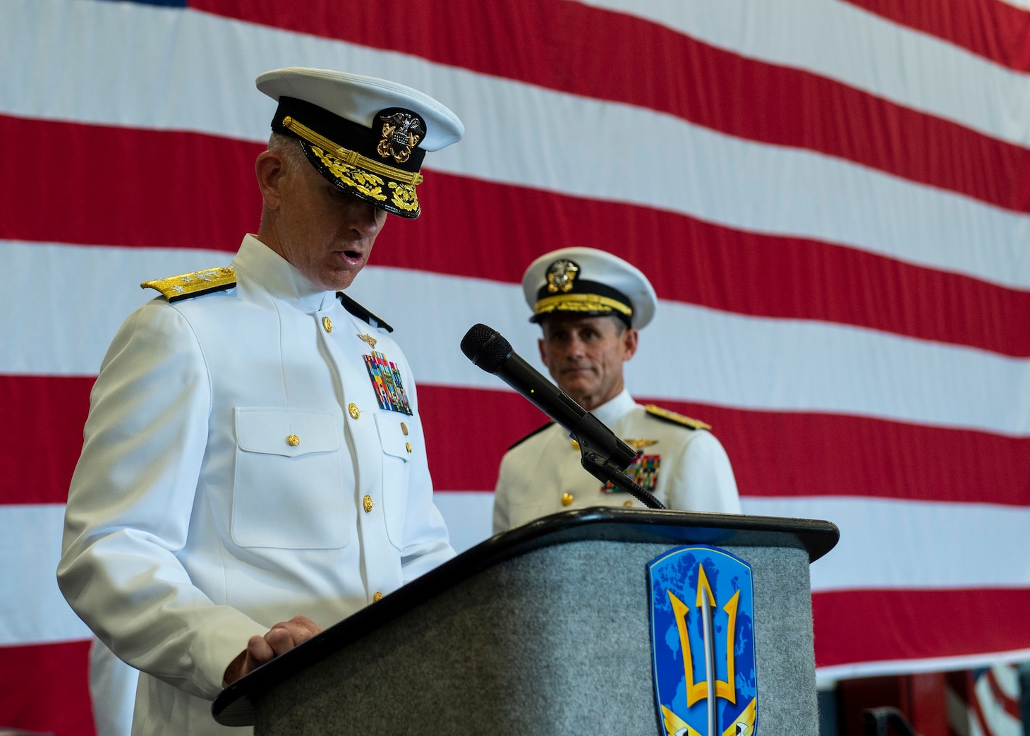 Vice Adm. Daniel Dwyer reads his orders during his Change of Command ceremony aboard the aircraft carrier USS Harry S. Truman (CVN 75) Aug. 20.
