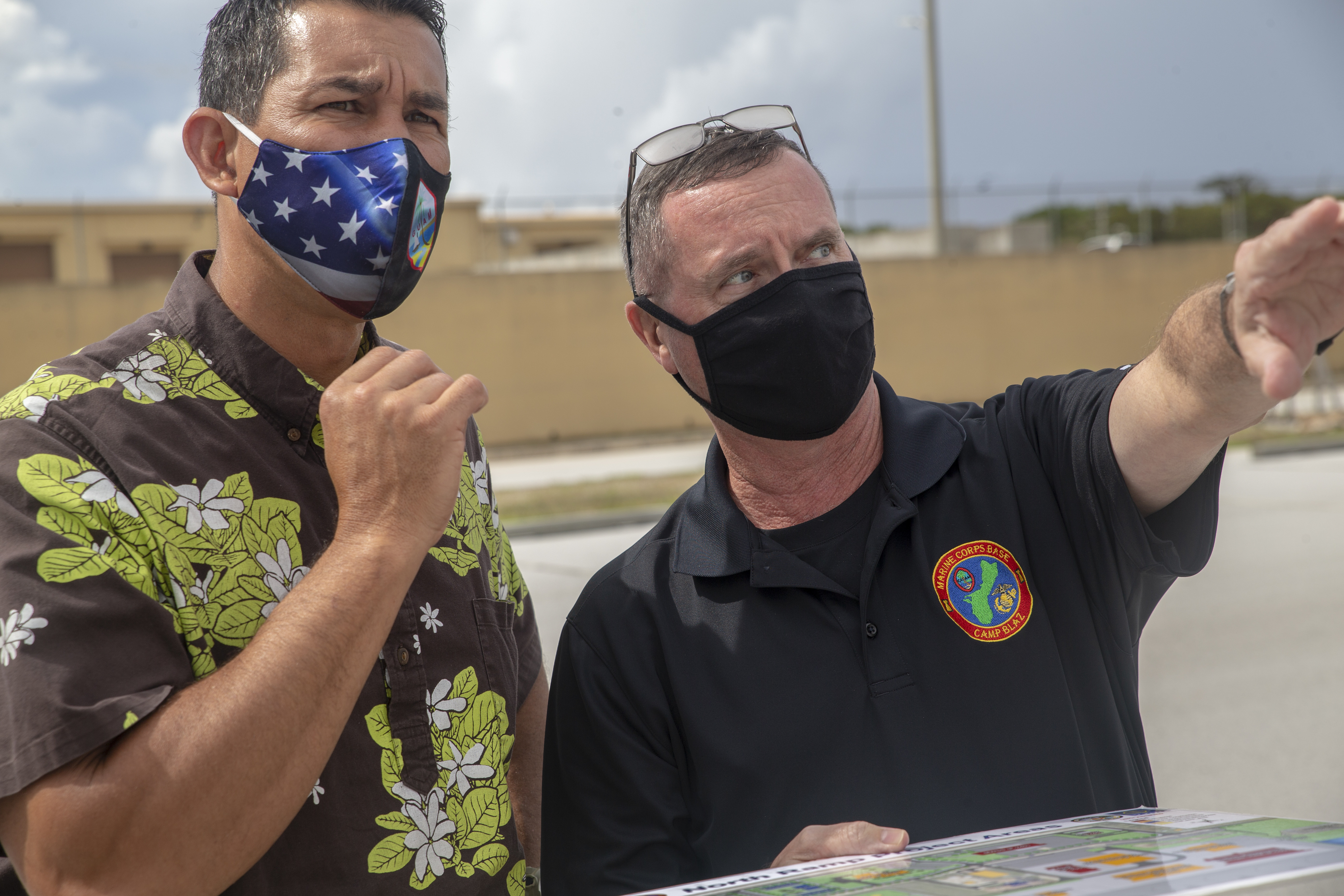 Donald Baldwin, the Marine Corps Base (MCB) Camp Blaz Chief of Staff, right, briefs Rep. Kai Kahele, Hawaii 2nd Congressional District, during a visit to the base, Aug. 11, 2021.