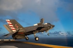 PHILIPPINE SEA (Aug. 20, 2021) An F-35B Lightning II fighter aircraft from Marine Fighter Attack Squadron (VMFA) 211, embarked on the Royal Navy aircraft carrier HMS Queen Elizabeth (R08), takes off from the flight deck of the forward-deployed amphibious assault ship USS America (LHA 6) during flight operations between and America and the Royal Navy. America, flagship of the America Expeditionary Strike Group, along with the 31st Marine Expeditionary Unit, is operating in the U.S. 7th Fleet area of responsibility to enhance interoperability with allies and partners and serve as a ready response force to defend peace and stability in the Indo-Pacific region. (U.S. Navy photo by Mass Communication Specialist 3rd Class Matthew Cavenaile)