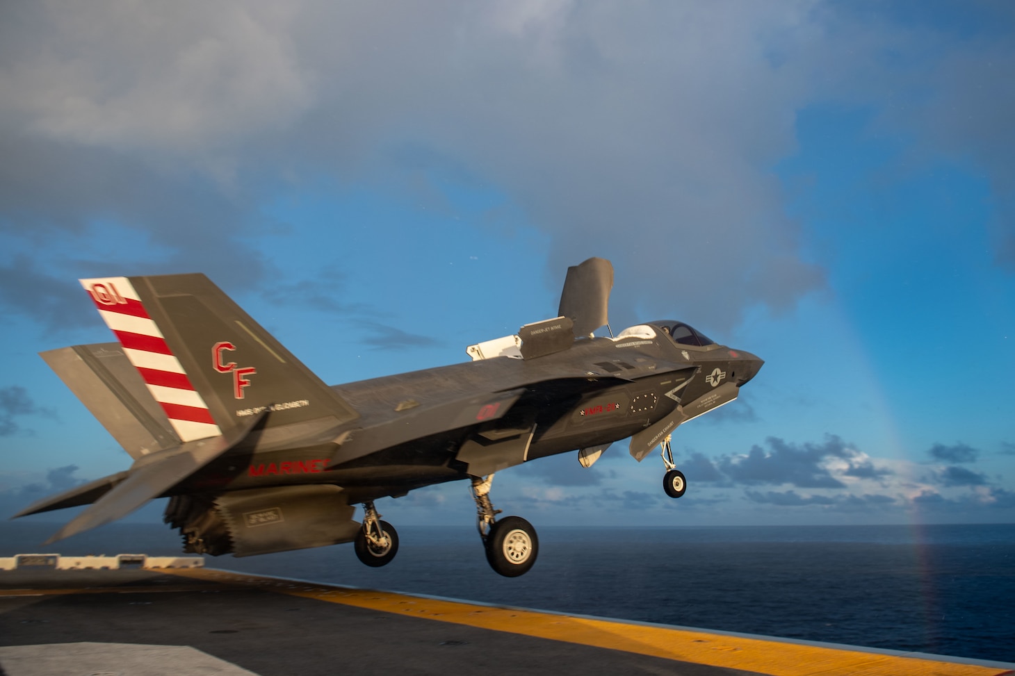 PHILIPPINE SEA (Aug. 20, 2021) An F-35B Lightning II fighter aircraft from Marine Fighter Attack Squadron (VMFA) 211, embarked on the Royal Navy aircraft carrier HMS Queen Elizabeth (R08), takes off from the flight deck of the forward-deployed amphibious assault ship USS America (LHA 6) during flight operations between and America and the Royal Navy. America, flagship of the America Expeditionary Strike Group, along with the 31st Marine Expeditionary Unit, is operating in the U.S. 7th Fleet area of responsibility to enhance interoperability with allies and partners and serve as a ready response force to defend peace and stability in the Indo-Pacific region. (U.S. Navy photo by Mass Communication Specialist 3rd Class Matthew Cavenaile)