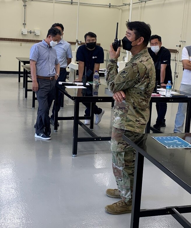 Sgt. 1st Class Danny Kim, FED Operations NCO, completes a radio check with each station, to confirm lines of communication are open, during communications training at the FED motor pool, Aug. 17. (U.S. Army photo by Sameria Zavala)